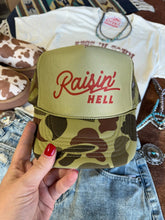 Load image into Gallery viewer, Raisin&#39; Hell Green Camo Trucker Hat
